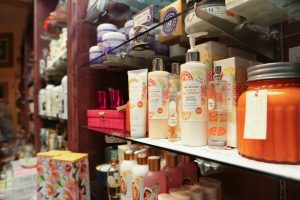 body care products on a shelf at Uncommon Scents at the Meridian